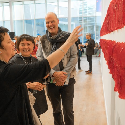 Sonya Kelliher-Coombs and audience in front of her work «Red Curl» at the preview of «Subsistence»